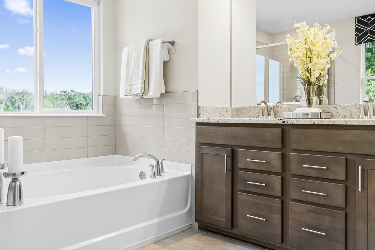 Garden tub with tile surround at primary bath