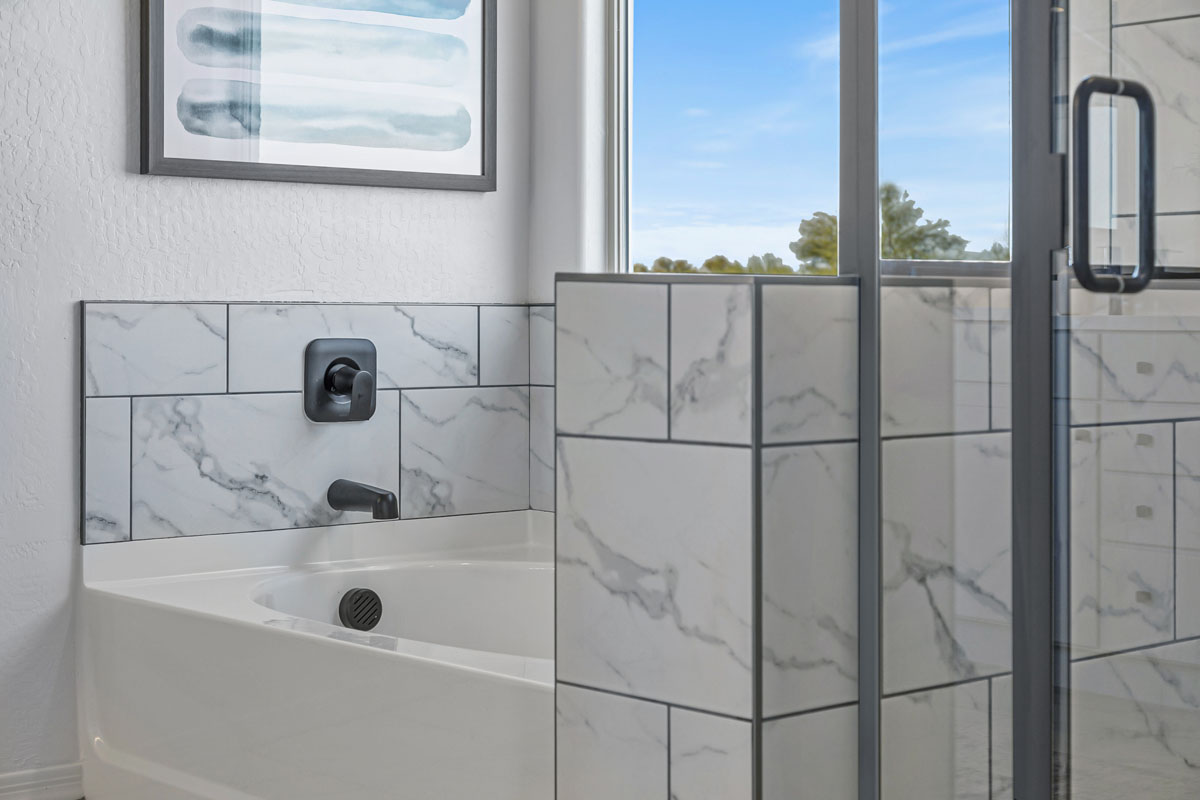 Separate shower and tub at primary bathroom