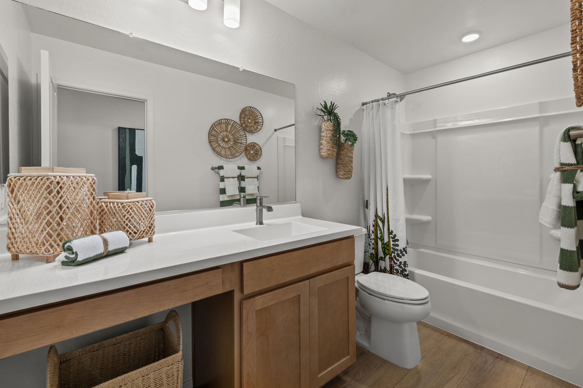 Extended vanity with knee space at secondary bath