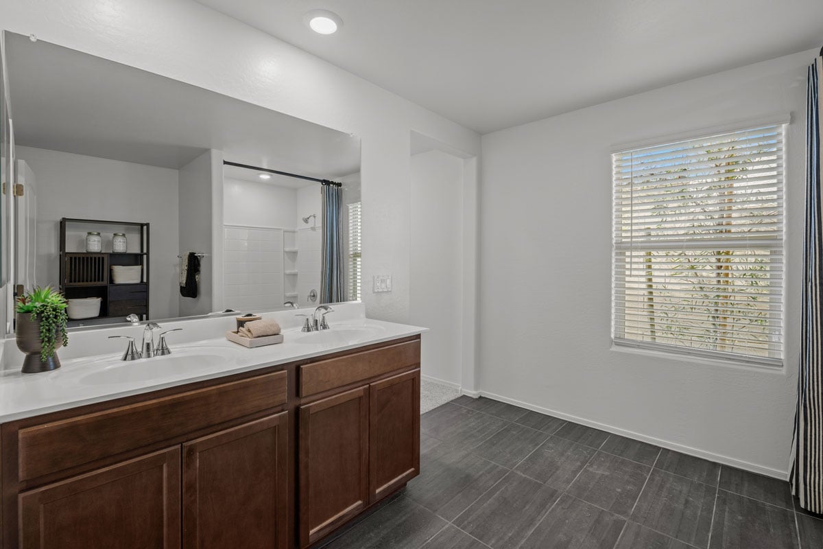 Dual sink vanity at primary bathroom