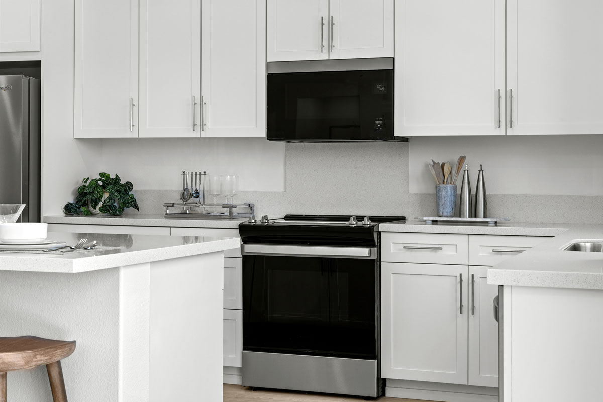 Shaker-style cabinets with chrome pulls