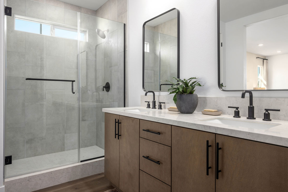 Walk-in shower with tile surround at primary bath