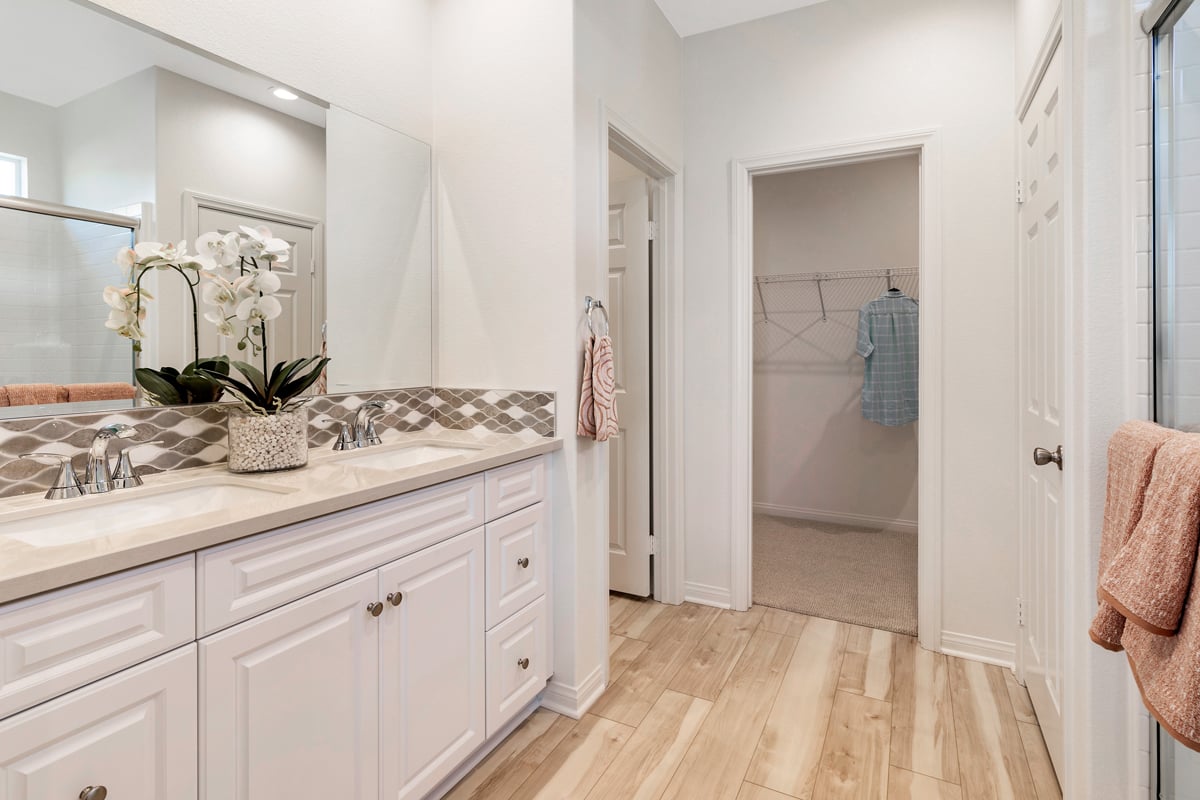 Upgraded countertop and backsplash at primary bath