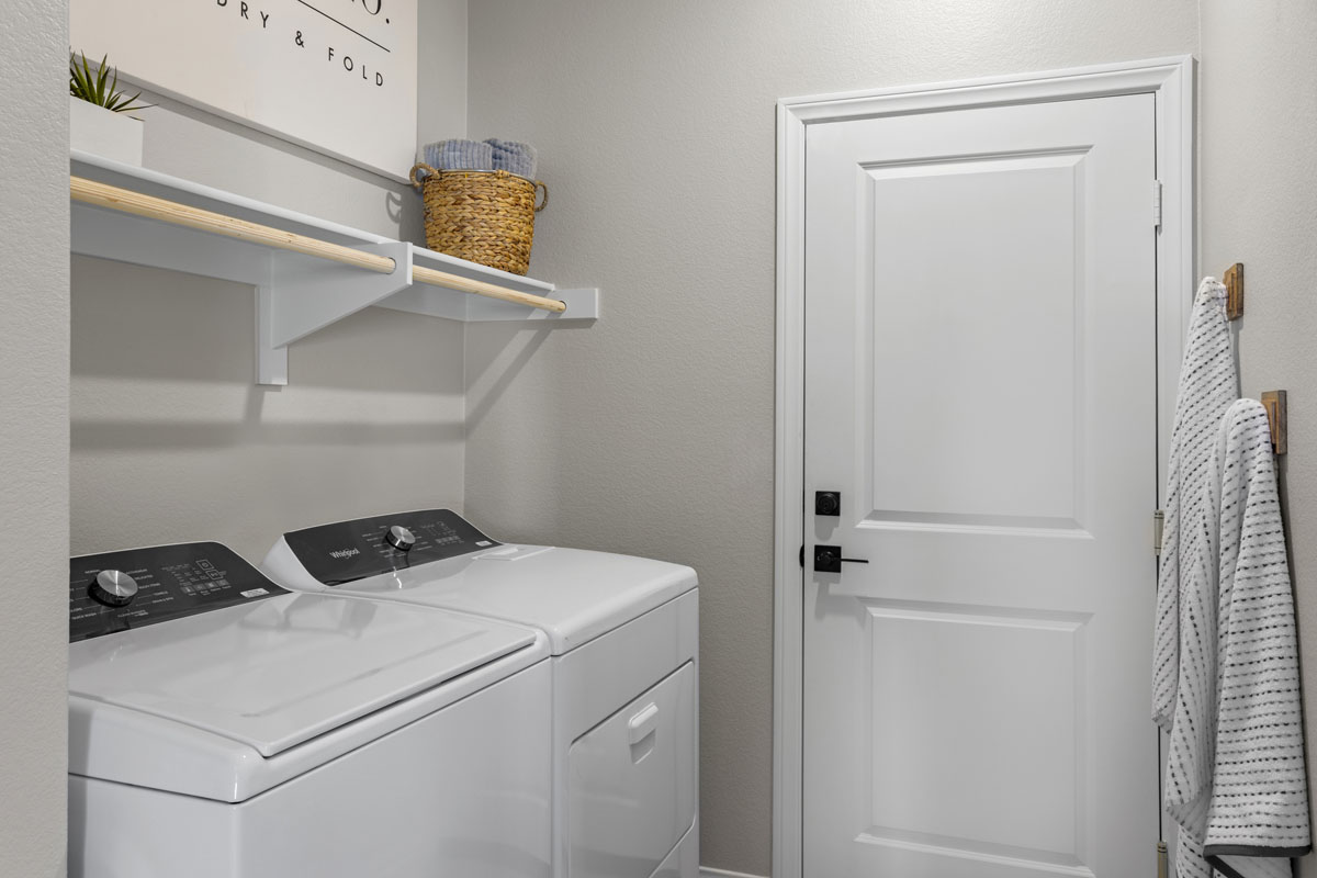 MDF shelves with wood poles at laundry