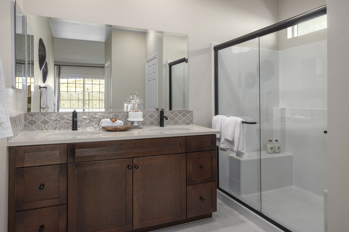 Shower with optional black frame enclosure at primary bath