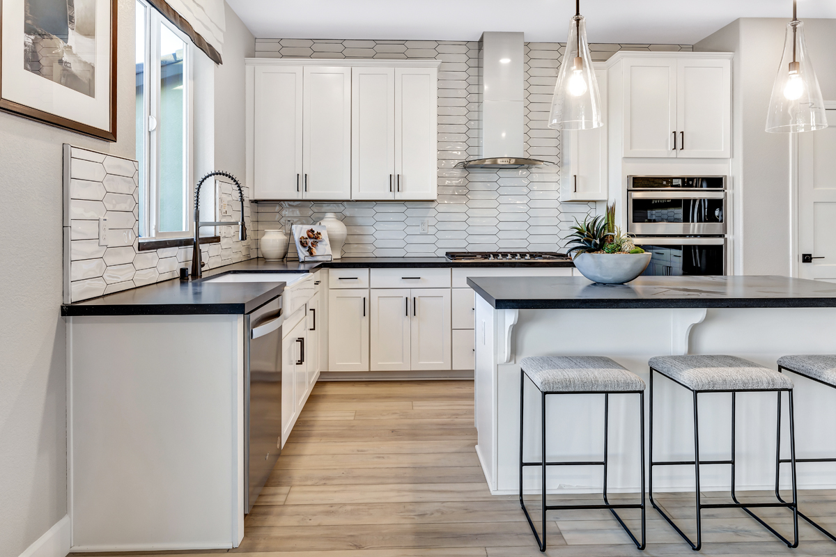 Kitchen with decorative backsplash and island