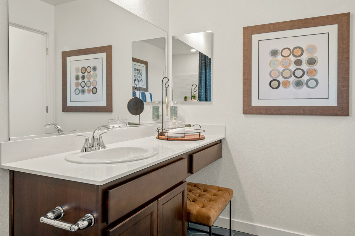 Extended vanity with knee space at secondary bath