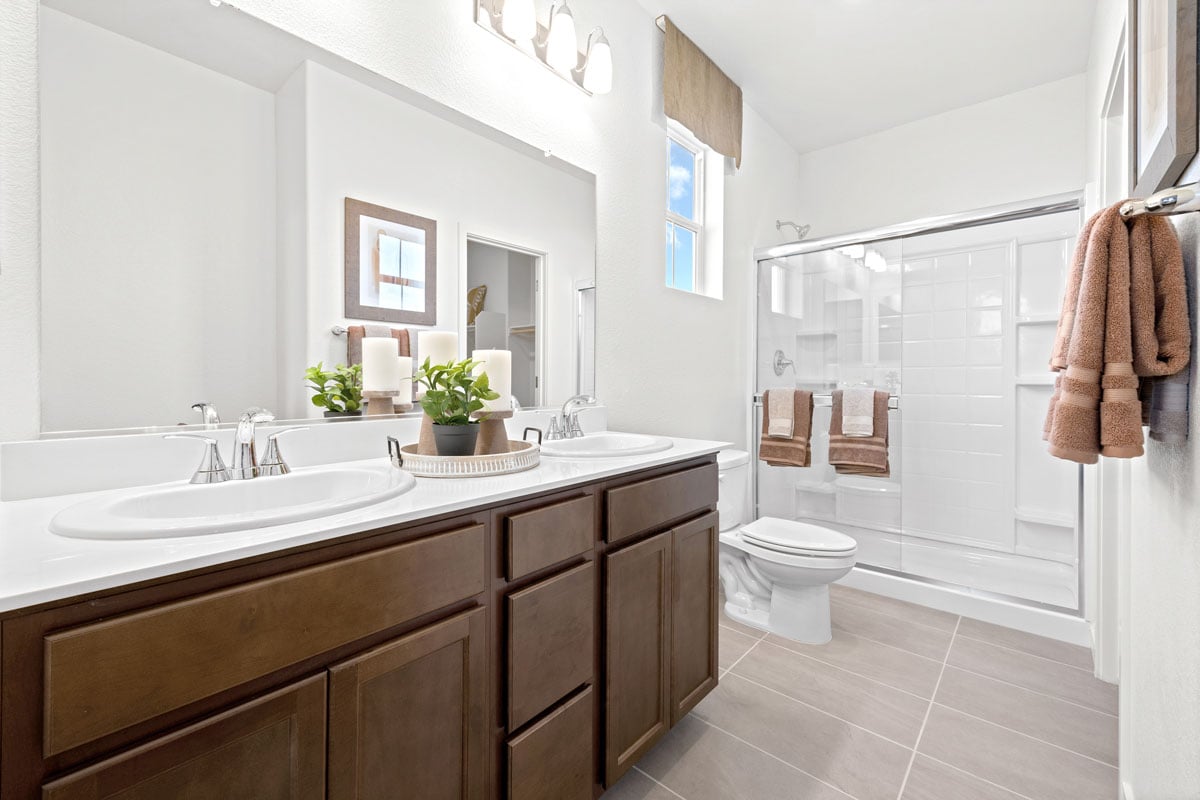 Walk-in shower with fiberglass surround and chrome finishes