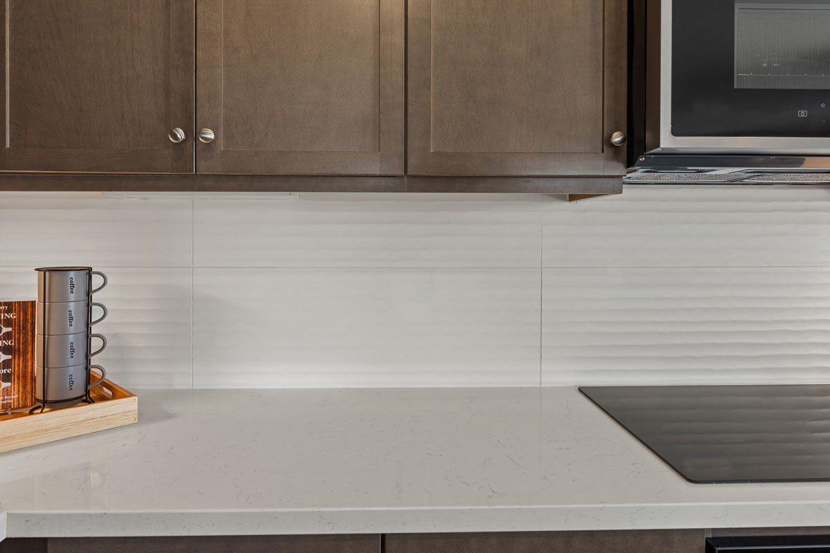 Optional quartz countertops and custom tile backsplash