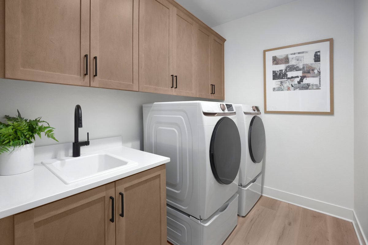 Sink and cabinets at laundry room