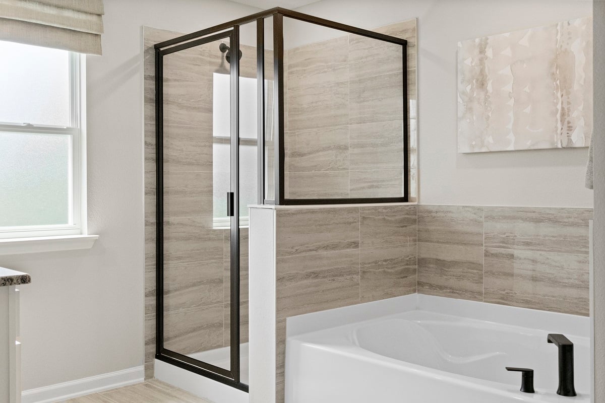 Garden tub with tile surround at primary bath