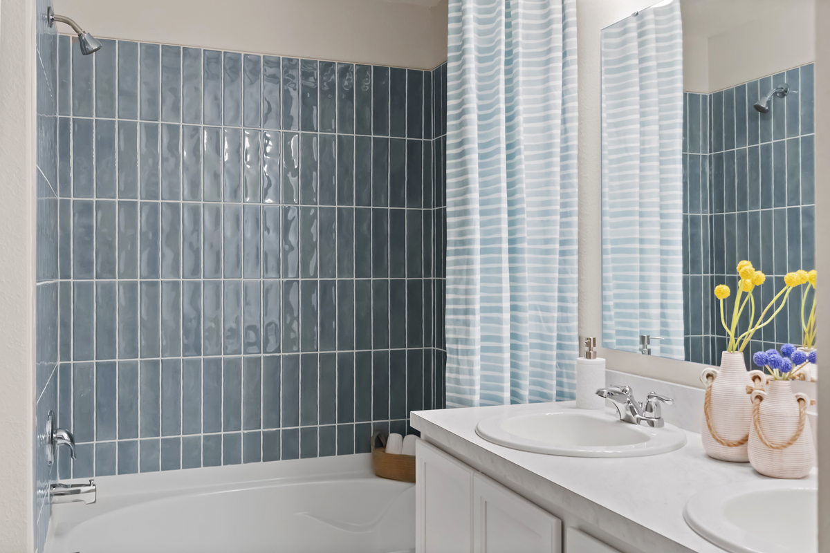 Garden tub with tile surround at primary bath