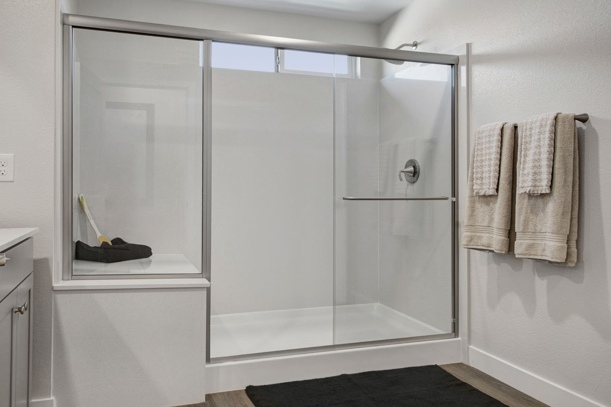 Enlarged shower with seat at primary bath