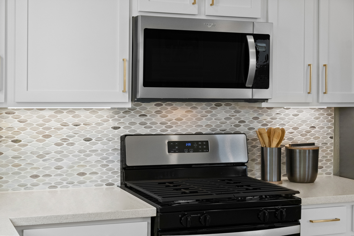 Tile backsplash at kitchen