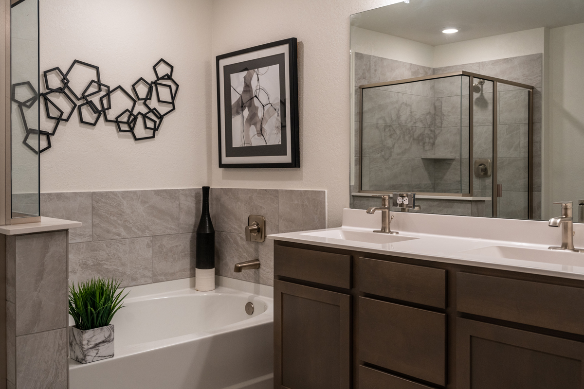 Separate garden tub and shower with tile surround