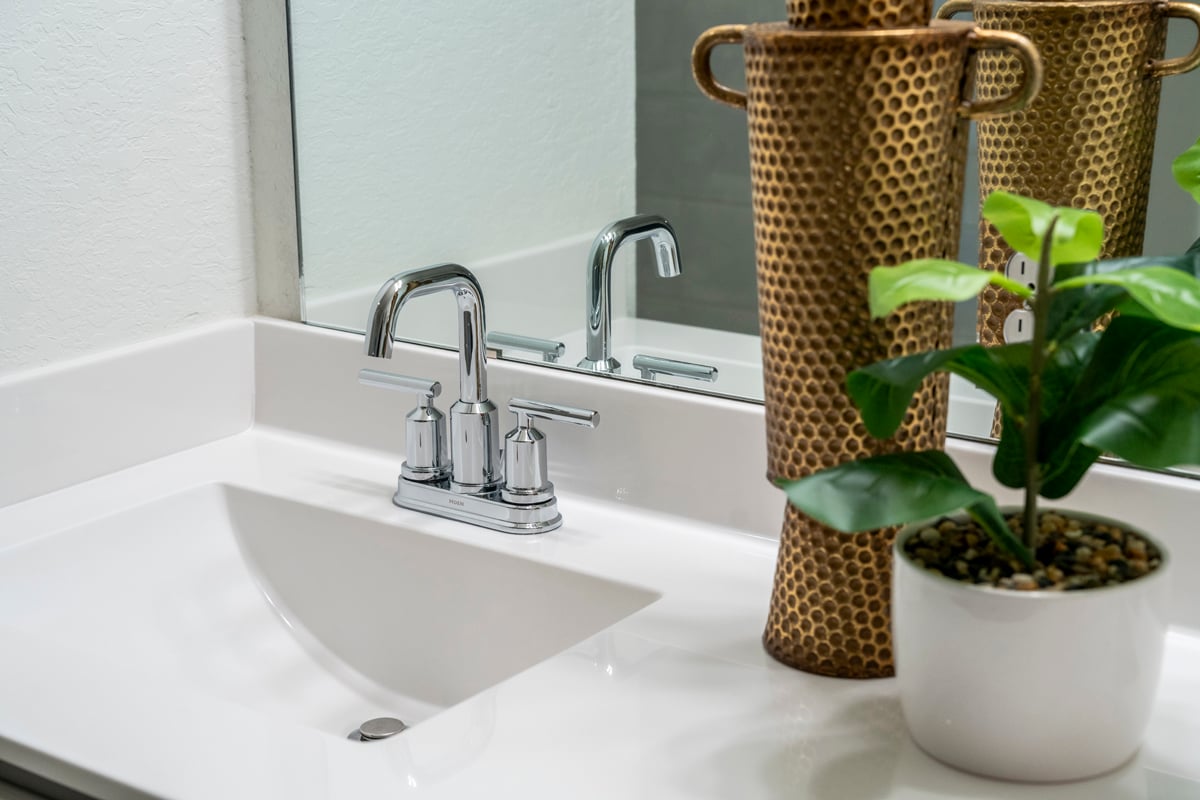 Cultured marble vanity with integrated sink at primary bath