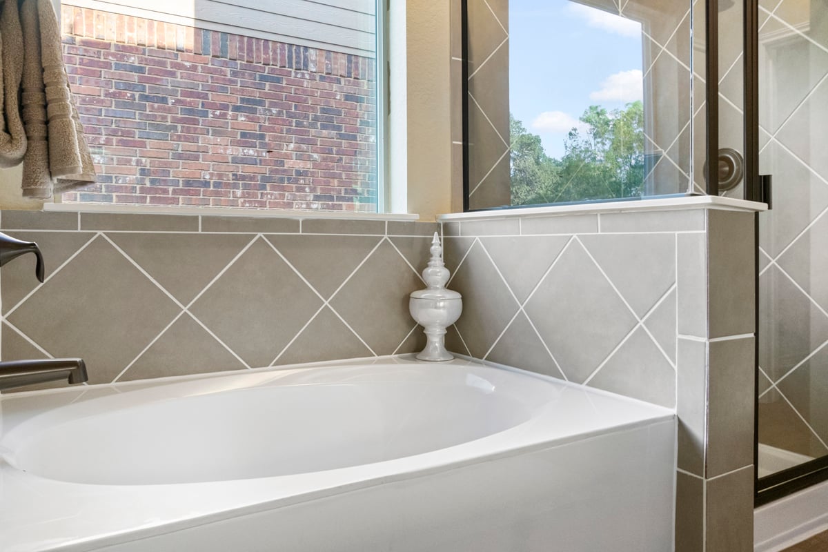 Separate marble garden tub and shower