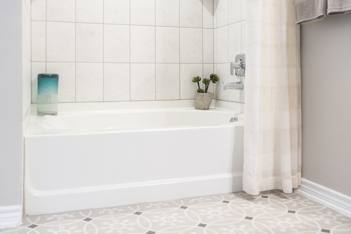 Garden tub with tile surround at primary bath