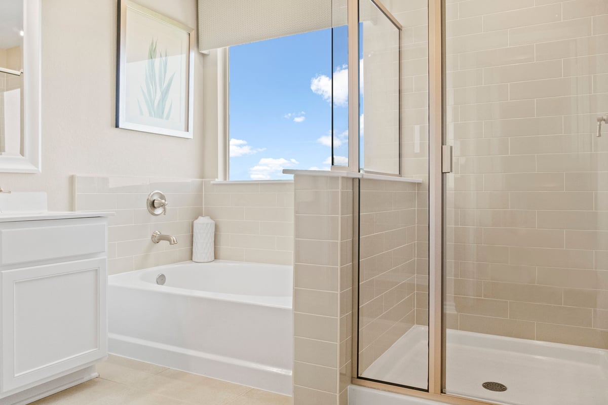 Garden tub and separate shower with tile surround at bath