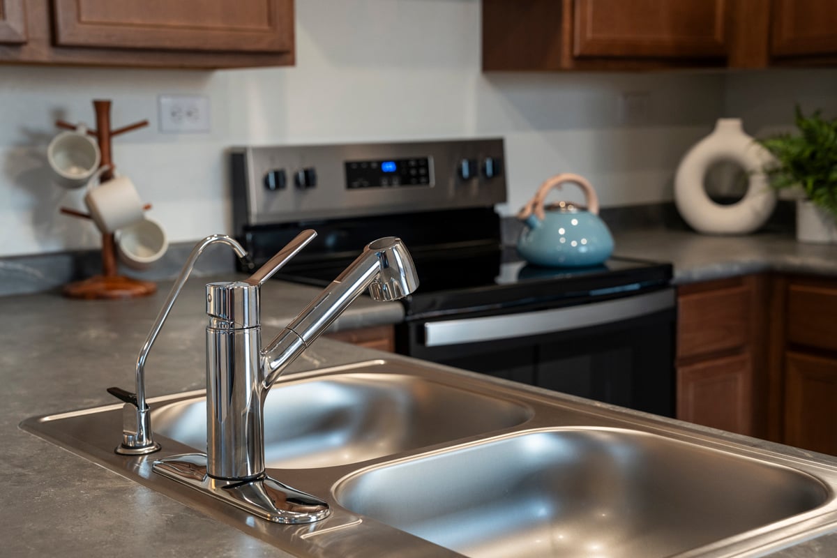 Dual-compartment stainless steel sink