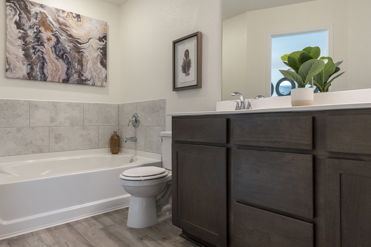 Garden tub with tile surround at primary bath