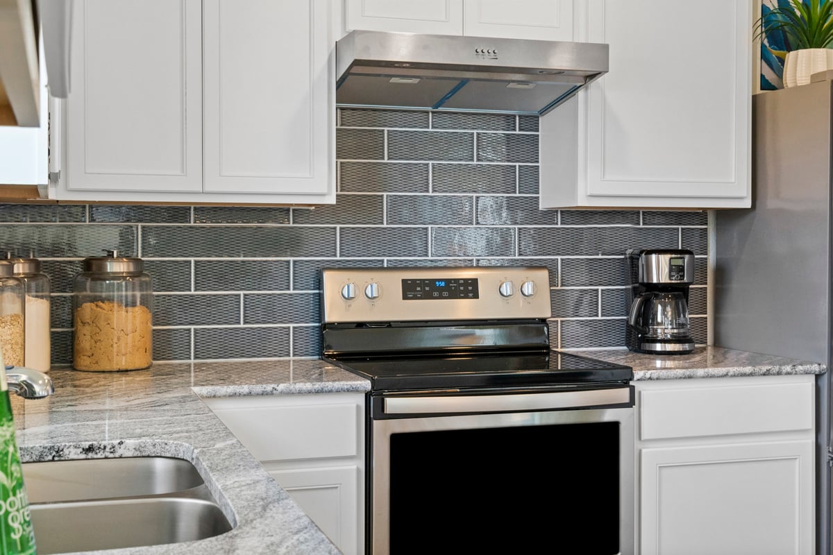 Tile backsplash at kitchen