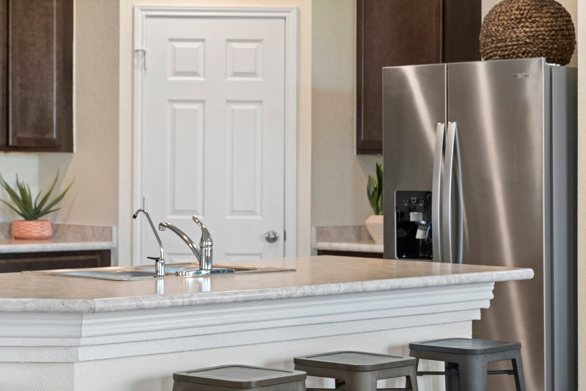 Stainless steel refrigerator at kitchen